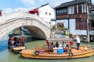 Ancient Stone Bridge Over Traditional Chinese Canal