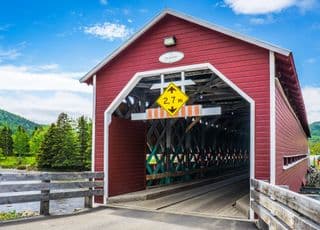 Red Wooden Covered Bridge in Quebec