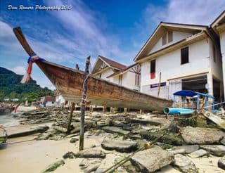 Weathered Boat Resting by the Shore
