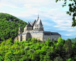 Medieval Fortress atop Verdant Hillside