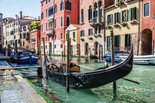 Gondola moored along the Grand Canal Venice