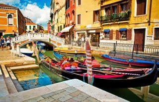 Gondolas Moored Along the Venetian Waterway