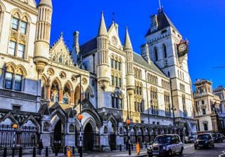 The Royal Courts of Justice in London Under Blue Skies