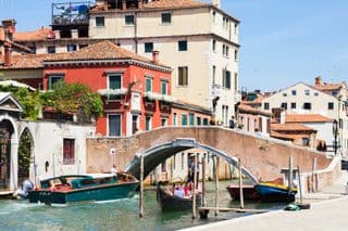 Gondolas Under the Bridge in Venice, Italy