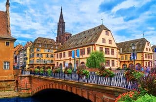 Strasbourg's Ponts Couverts Under Blue Skies
