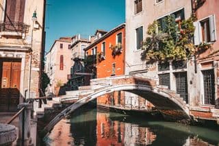 An Arched Bridge Over the Canal in Venice