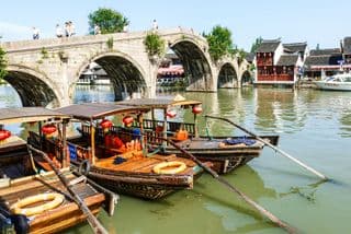 Ancient Stone Bridge Over Calm River in Zhujiajiao