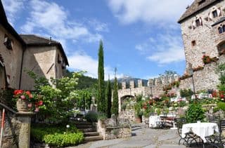 Medieval Castle Courtyard with Blooming Gardens