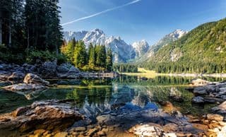 Reflective Lago di Fusine in the Italian Alps