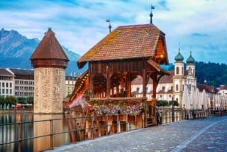 Lucerne's Chapel Bridge and Jesuit Church by the Reuss River