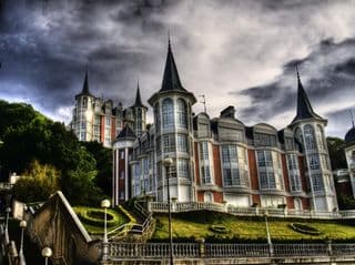 Elegant Victorian Mansion amidst Dramatic Skies