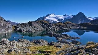Reflective Alpine Lake in Mount Aspiring National Park, New Zealand
