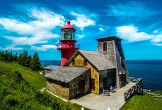 Red Lighthouse by the Sea in Canada
