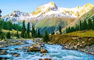 Snow-Capped Mountain and Rocky Stream