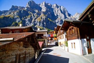 Traditional Swiss Chalets Nestled Against the Alps