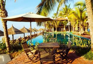 Relax by the Infinity Pool at a Tropical Vietnamese Resort