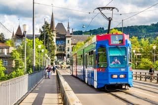 Blue Tram Crossing Kirchenfeldbrücke in Bern