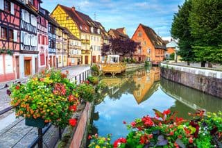 Colorful Half-Timbered Houses by the River in Petite Venise, Colmar, France