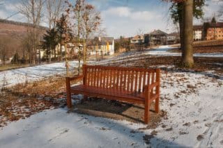 Wooden Bench Amidst Winter's Touch in Wertheim, Germany