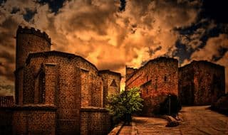 Medieval Fortress under Sunset Sky