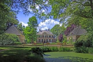 Traditional Dutch Manor House amidst Summer Greenery