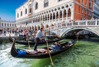 Gondoliers Plying the Canals of Venice
