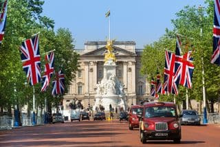 Flags Flanking Buckingham Palace in London