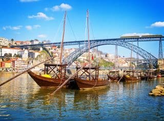 Traditional Rabelo Boats at Dom Luís I Bridge