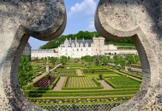 Formal Gardens of Château de Villandry Through an Archway