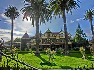 The Winchester Mystery House amidst Majestic Palm Trees