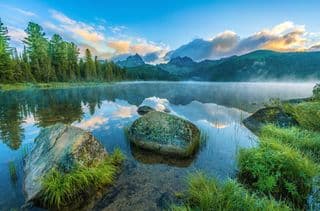 Morning Mist Over Mountain Lake Shore