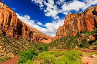 Zion's Natural Rock Arch Under Blue Sky