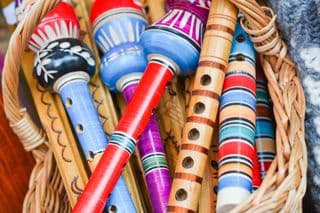 Colorful Traditional Flutes in Basket