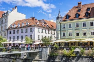 Pedestrians Crossing Triple Bridge in Ljubljana