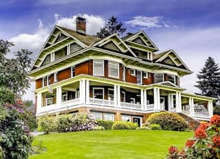 Victorian Mansion amidst Blooming Gardens