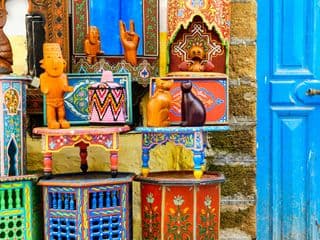 Vibrant Carved Wooden Figures and Tables