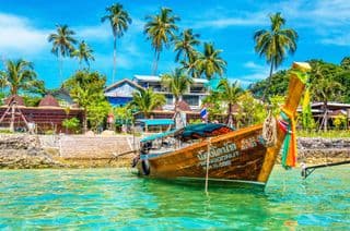 Traditional Thai Boat Moored in Tropical Paradise
