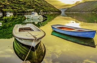 Boats in Lim Fjord at Sunset