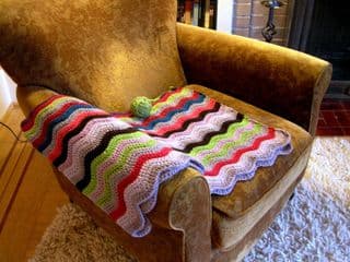 Warmth in Wool: A Ripple Afghan and Ball of Yarn