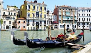 Gondolas moored along the Grand Canal Venice