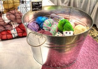 Vibrant Yarn Display in Metal Bucket