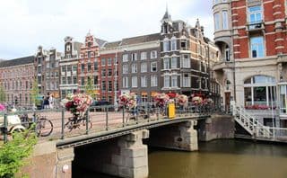 Bicycles and Blooms over an Amsterdam Canal
