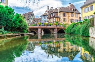 Reflection of Colmar's Old Bridge in the River