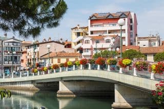 Flower-Adorned Bridge Over the Adriatic Sea in Grado, Italy